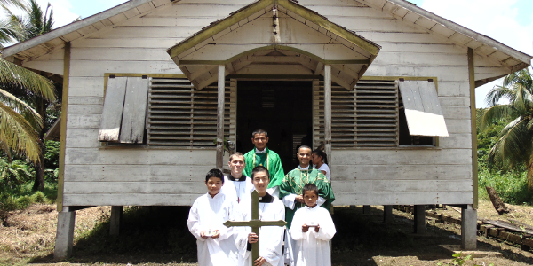 IVE Missionaries assist Fr. Humberto Villa, IVE and local altar boys with Mass in Guyana during the summer mission trip. After Mass at the IVE summer mission trip in Guyana